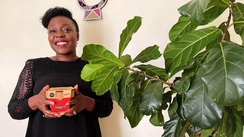 Nanjala holding a Nanjala Edible Grow Kit for Kids.(2022) © The Nanjala Company Limited