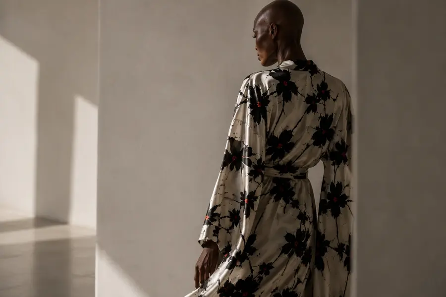 3D digital dress visualized on a black model wearing a kimono with the Black Petals print by © Nanjala Design aerial view by Daniel Echessa (2026) 4/8